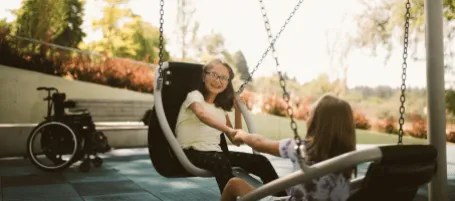 Siblings on a swing