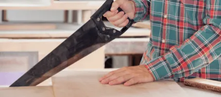 Manual sawing work that released asbestos dust during carpentry