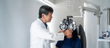 ophthalmologist examining an eye