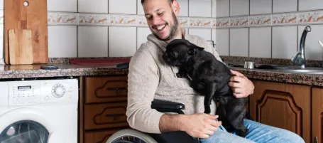 A person with a pet in a care
