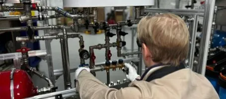 Image of man doing plumbing