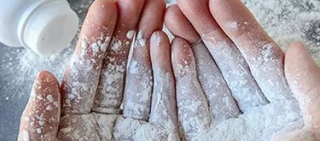 Image of hands with dust